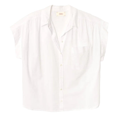 The Lexi Shirt by Xirena is a lightweight cotton, button-front shirt featuring short sleeves, a front chest pocket, spread collar, and a relaxed fit, shown on a plain white background.