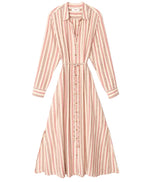 The Bowen Stripe Dress by Xirena features pink and white vertical stripes, long sleeves, a button-down front, collared neckline, matching tie belt at the waist, and is crafted from a soft viscose-linen blend.