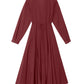 The Louisa Dress by Xirena is a long-sleeved, ankle-length maroon button-front dress featuring a collar, buttoned cuffs, and a thin waist tie, shown against a white background.