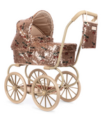 Konges Slojd Sparkly Minnie Doll Pram in a vintage style with rose gold sequins, a cherry print, large wheels, a foldable sun canopy, and a matching hanging bag.