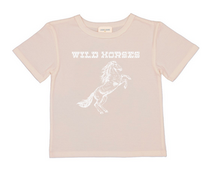 Introducing the Girls’ Tom Wild Horses T-Shirt by Louis Louise: a light beige tee showcasing a white wild horse graphic, topped with “WILD HORSES” in a bold western-inspired font—ideal for adventurous kids and perfect for nature lovers.