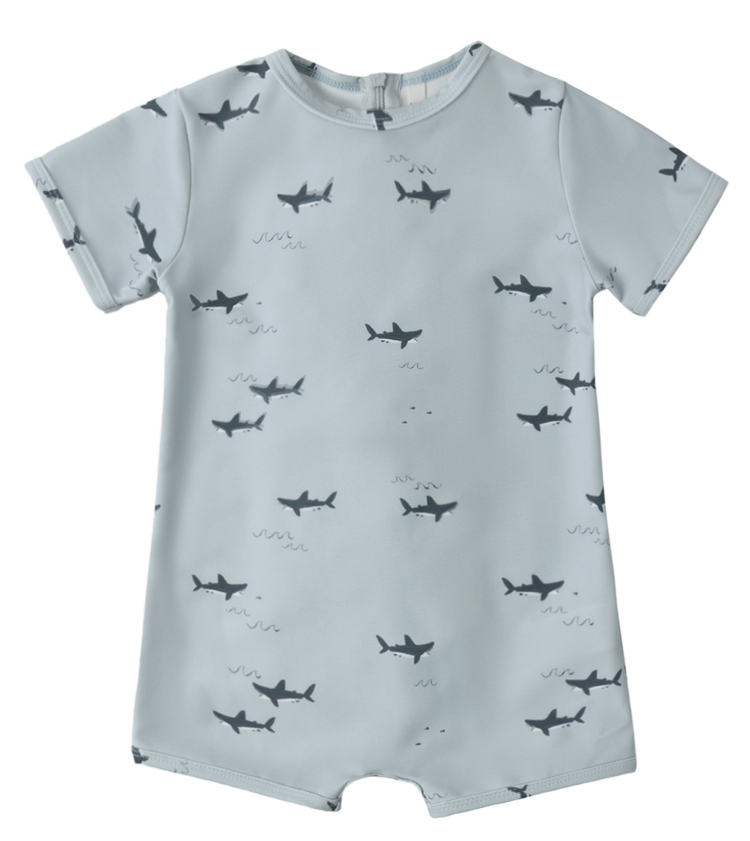 The Rylee & Cru Baby Boys' Shorty One-Piece features light blue fabric with dark shark silhouettes, small waves, and UPF 50+ protection—perfect for sunny adventures.
