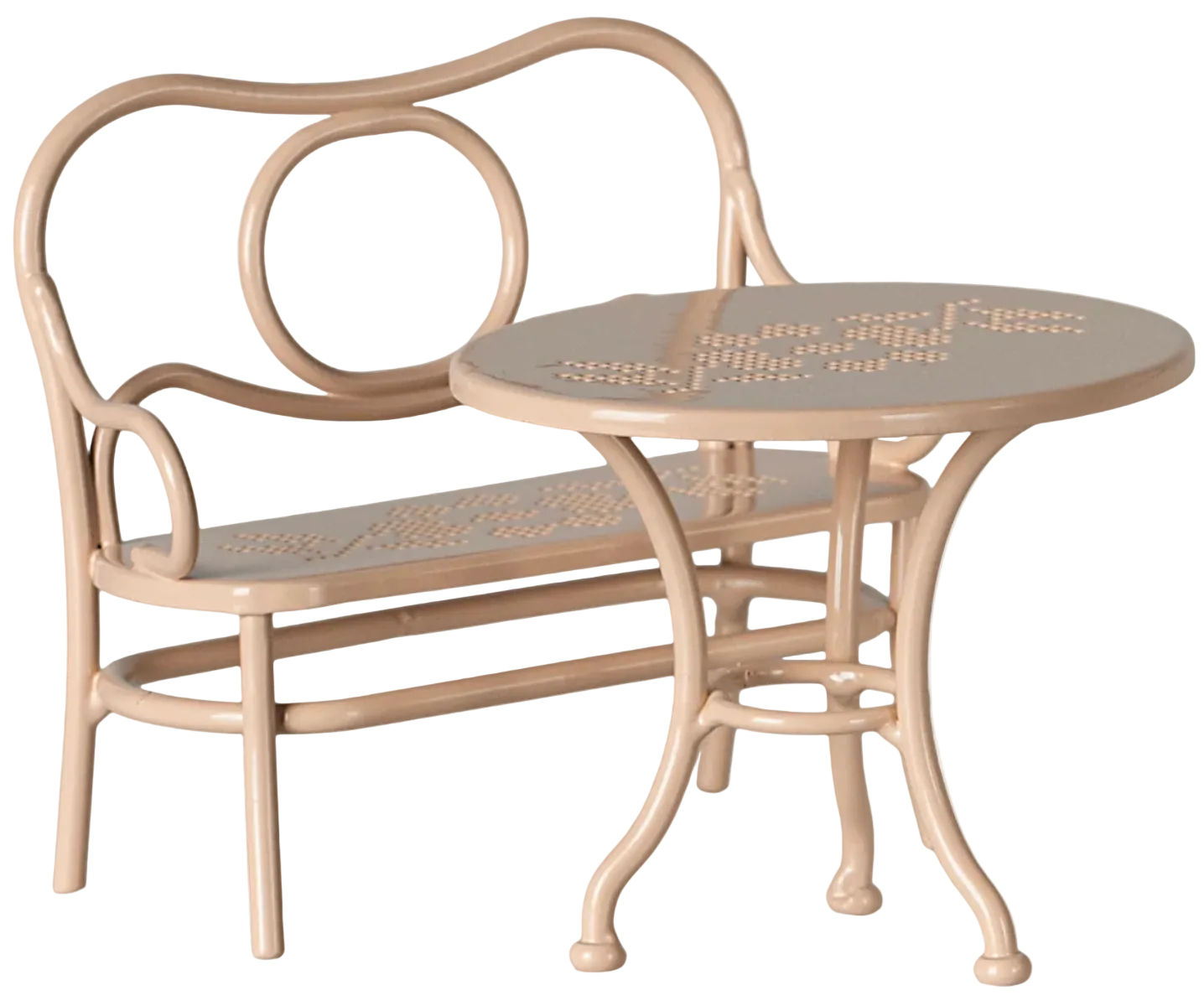 Big pale pink metal cafe set by Maileg, featuring a mouse-sized bench with curved backrest and a matching round table, both adorned with perforated floral patterns—a charming addition for relaxing at Mouse Hole Farmhouse.