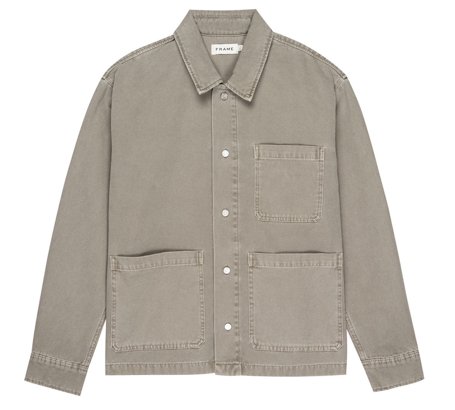 The Frame Canvas Chore Coat, in light brown cotton canvas, features a collar, button-down front, and three front patch pockets, shown flat on a white background.