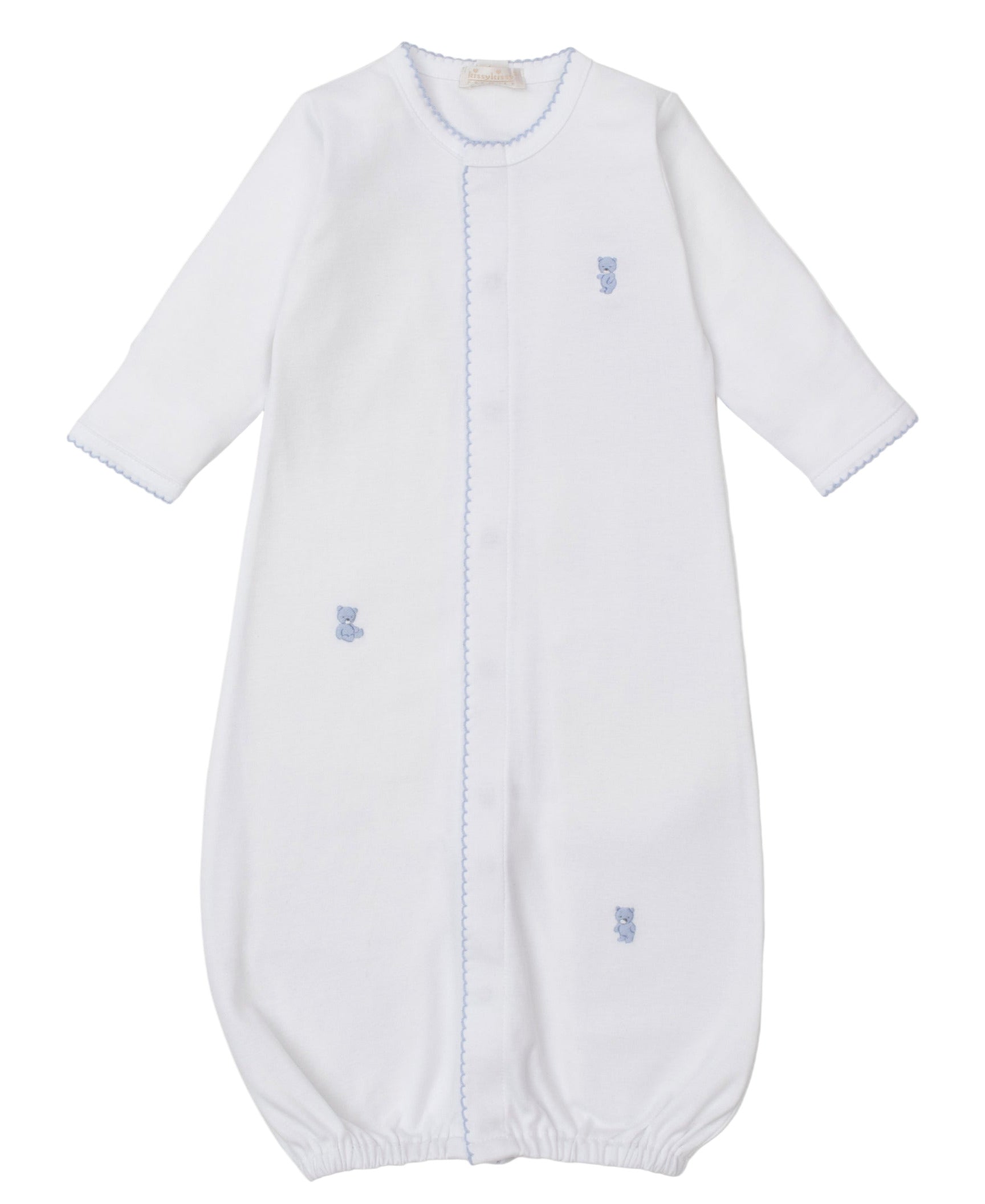 The Kissy Kissy Baby Teddy Bear Time Converter Gown with Hand Embroidery is made from premium Peruvian cotton, features long sleeves, blue trim, embroidered teddy bear and duck details, elastic bottom, and a front closure.