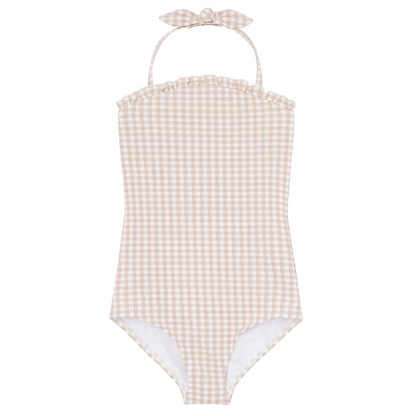 The Minnow Girls Halter One Piece with Tie Knot by Minnow showcases a beige gingham pattern, adjustable halter ties, and a charming ruffle detail at the neckline. The textured fabric enhances its appeal as a must-have for summer.