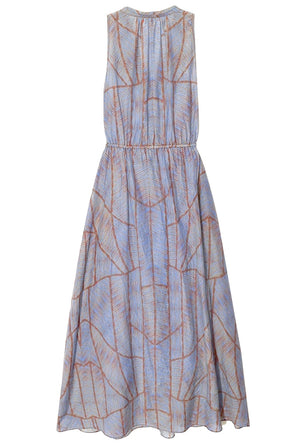 The Xirena Darby Dress by Xirena is a sleeveless, knee-length dress with an adjustable waist. The fabric features a geometric pattern in shades of blue and brown, crafted from silk cotton voile for added elegance.