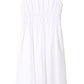 The Xirena Cyra Dress, made from cotton poplin, features a white, knee-length design with an elastic waistband. Displayed on a plain white background, its simplicity and flowy style make it a versatile addition to any wardrobe.