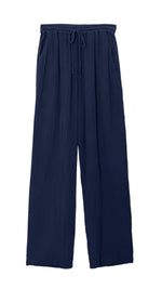 The Xirena Dylan Pant by Xirena is a pair of navy blue wide-leg pants made from double-faced cotton gauze, featuring an elastic drawstring waistband for a comfortable fit.