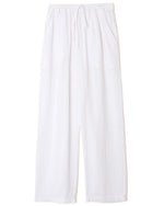 The Xirena Dylan Pant by Xirena features white wide-leg cotton gauze construction, an elastic drawstring waist, and side seam pockets.