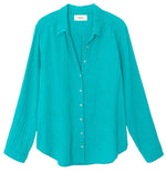 Bright turquoise button-up long-sleeve Xirena Scout Shirt, crafted from 100% cotton, displayed on a white background.