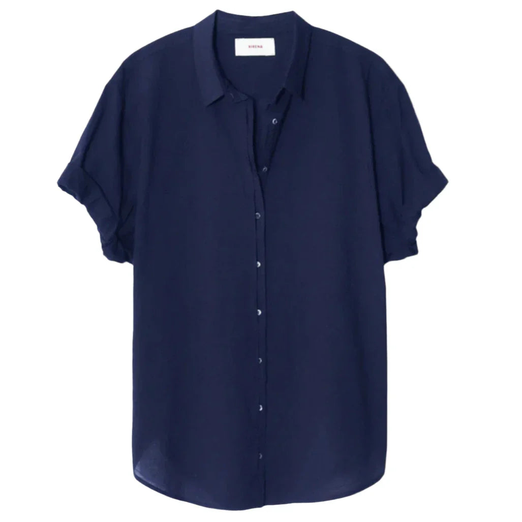 Navy blue short-sleeve Xirena Channing Shirt by Xirena, made from lightweight cotton poplin, with a collar and cuffed sleeves, hanging against a white background.