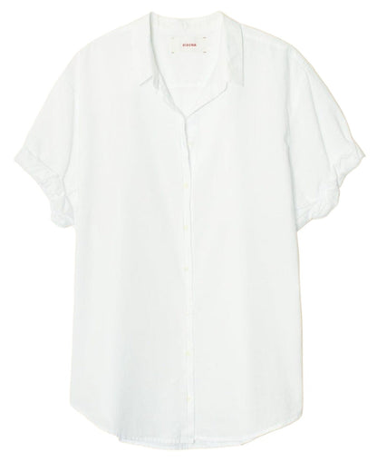 The Xirena Channing Shirt: A plain white short-sleeved button-up crafted from lightweight cotton poplin, featuring a collar and rolled-up sleeves for that perfect boy meets girl attitude.