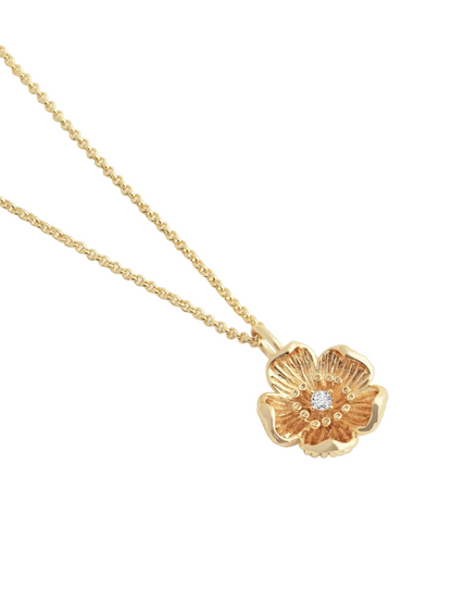 The Anabel Aram Wildflowers Pendant Necklace features an 18k gold dipped chain and a flower-shaped pendant with a central diamond-like stone for a radiant, nature-inspired look.