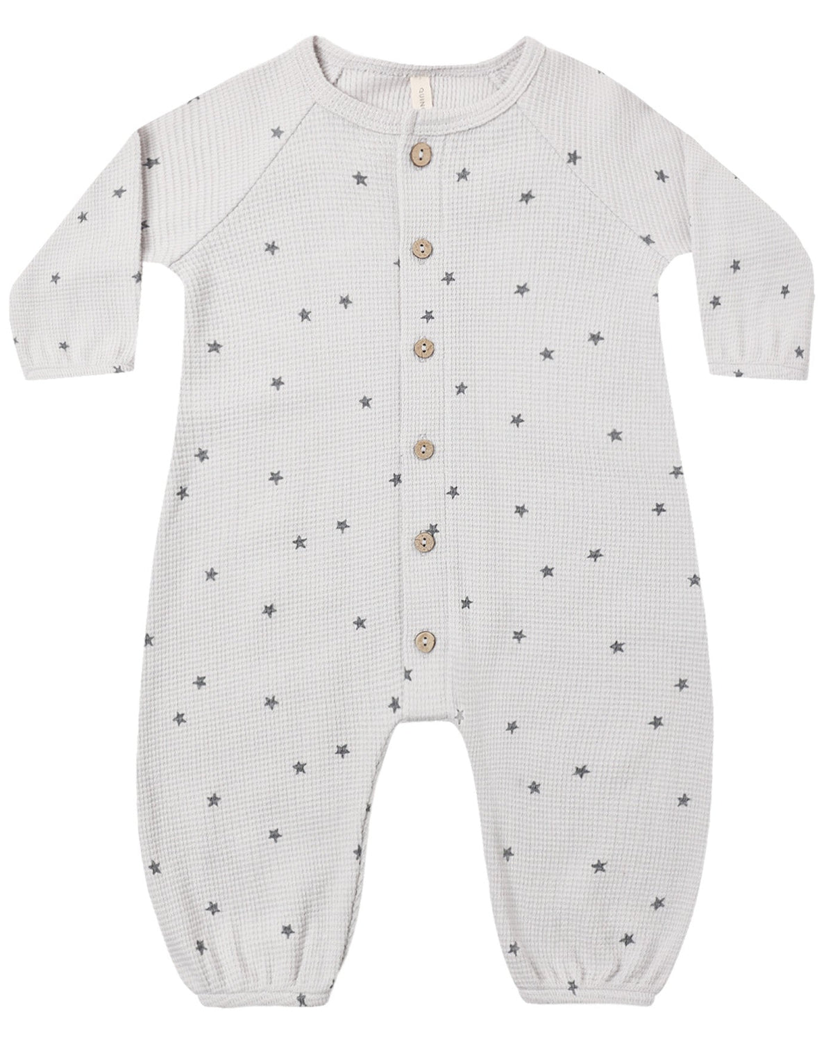 The Quincy Mae Baby Boys’ Waffle Long Sleeve Jumpsuit, shown flat on a white background, features a cozy waffle knit fabric with a subtle small star pattern, front button closure, and elasticized cuffs.
