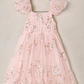 Noralee Girls’ Clara Dress in pink, featuring a smocked bodice, sleeveless tulle design, square neckline, ruffled sleeves, and silver star-shaped sequins.