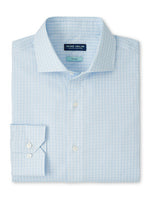 The Peter Millar Dante Cotton Sport Shirt features a light blue checkered pattern, cutaway collar, and button cuff. Men's cotton dress shirt is shown folded neatly.