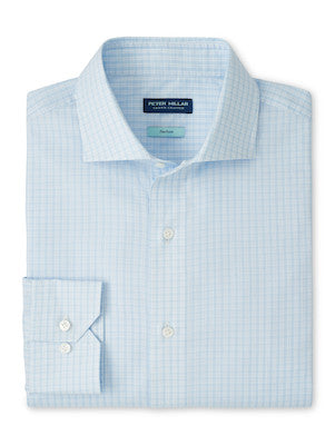 The Peter Millar Dante Cotton Sport Shirt features a light blue checkered pattern, cutaway collar, and button cuff. Men's cotton dress shirt is shown folded neatly.