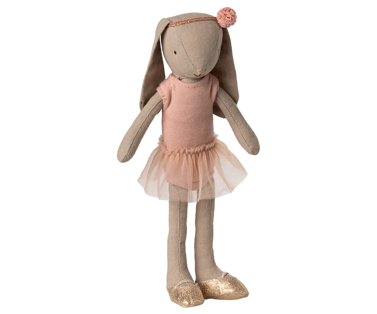The Maileg MAIL Bunny size 2, Classic, wears a ballet suit and rose skirt with headband and gold shoes. This plush doll stands upright against a plain background.