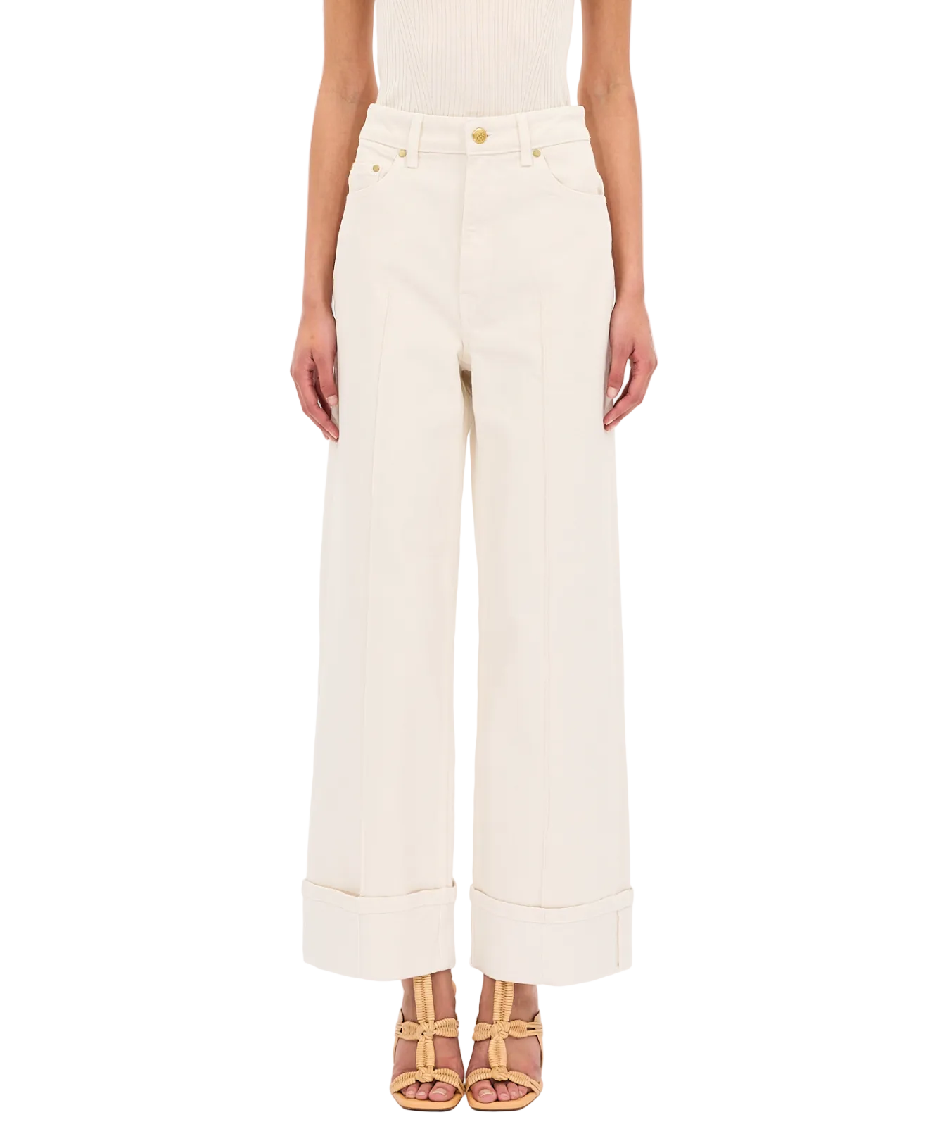 Genevieve Jean showcases effortless style in Ulla Johnson's Genevieve Stretch Jean, a wide-leg white denim pant.
