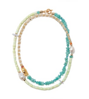 The Lizzie Fortunato Cabana Necklace features semiprecious beads in green, beige, and turquoise, with two pearl accents and a gold clasp.