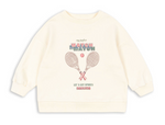 The Kids’ Loupy Lou Sweatshirt by Konges Slojd is a cream crewneck made from soft cotton, featuring two crossed tennis rackets, a tennis ball, and the text “my perfect MATCH MATCH, LET’S GET SPORTY DARLING” on the front.