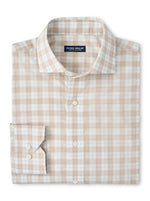 The Peter Millar Venzone Italian Poplin Sport Shirt is a folded, long-sleeve button-up with a light brown and white plaid pattern, spread collar, and buttoned cuffs.