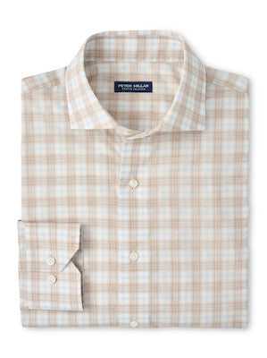 The Peter Millar Venzone Italian Poplin Sport Shirt is a folded, long-sleeve button-up with a light brown and white plaid pattern, spread collar, and buttoned cuffs.