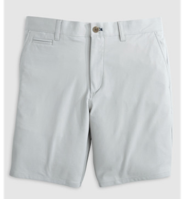 Jupiters Short by Johnnie-O in light grey, knee-length with belt loops, button closure, and front pockets, crafted from performance cotton and laid flat on a plain background.