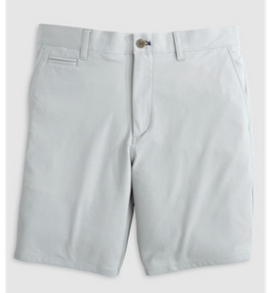 Jupiters Short by Johnnie-O in light grey, knee-length with belt loops, button closure, and front pockets, crafted from performance cotton and laid flat on a plain background.