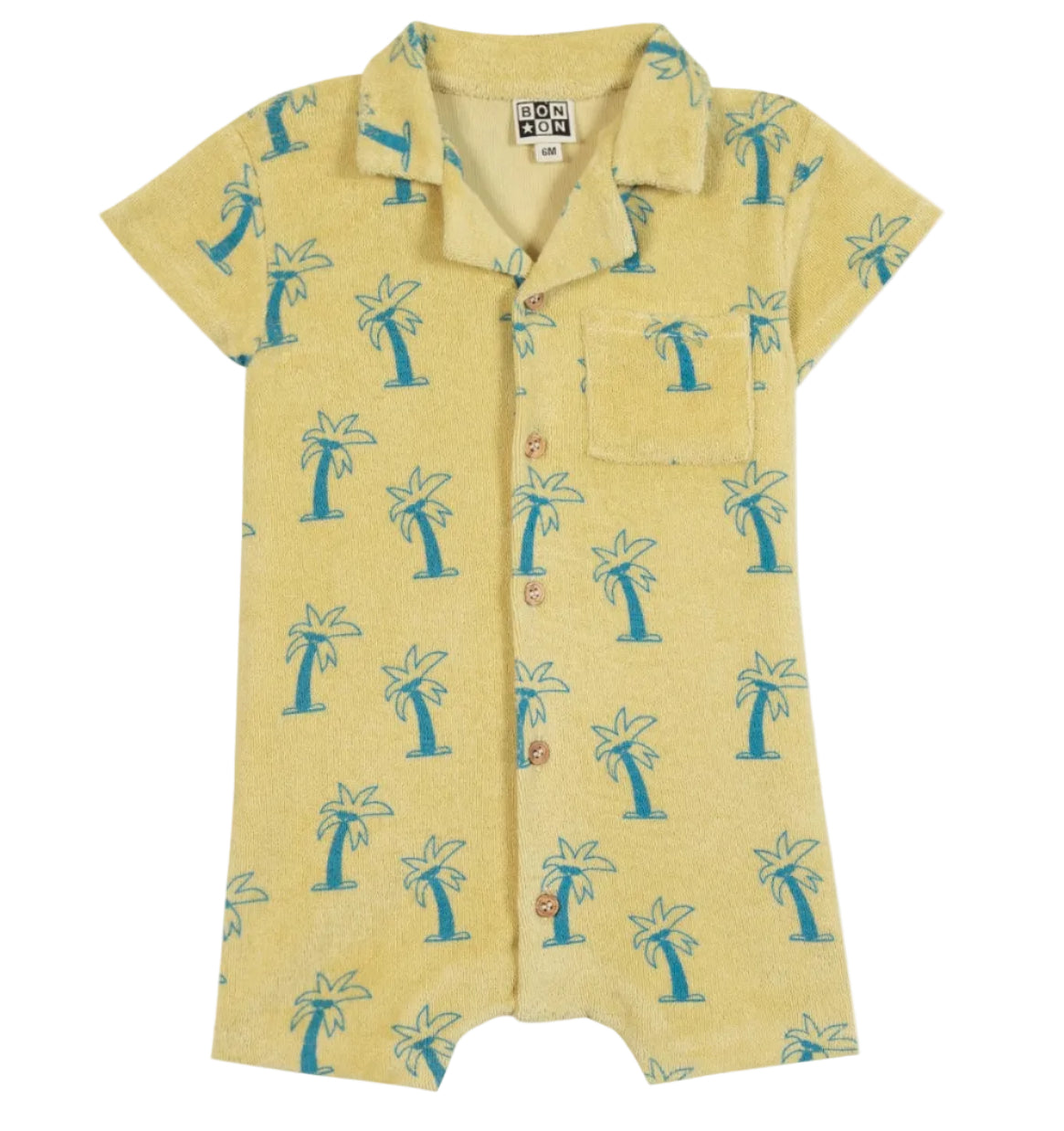The BTN Lilo Onesie by Bonton is a vibrant yellow short-sleeve romper featuring a blue palm tree print, front buttons, collar, and chest pocket—expertly crafted from soft cotton for all-day comfort.