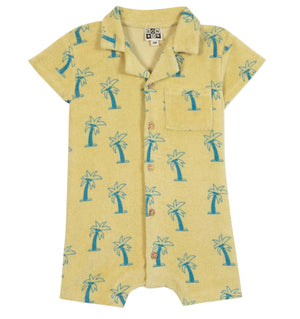 The BTN Lilo Onesie by Bonton is a vibrant yellow short-sleeve romper featuring a blue palm tree print, front buttons, collar, and chest pocket—expertly crafted from soft cotton for all-day comfort.