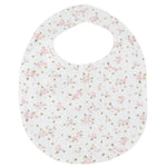 A charming Tartine et Chocolat bib for newborns, featuring a pink floral pattern and a round neck opening, crafted from soft, unbleached cotton and shown laid flat on a plain background—an ideal baby mealtime accessory.