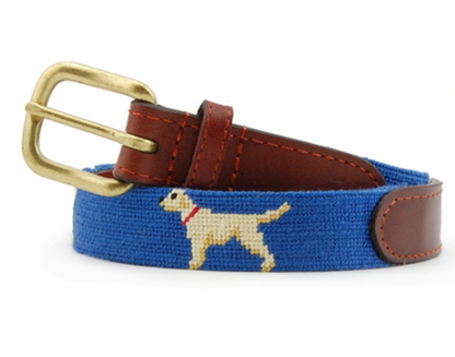 Crafted from full grain leather, the Smathers & Branson Children's Yellow Lab Belt is a blue boys' accessory that features a brass buckle and a charming cross-stitched white dog with a red collar, making it perfect for children's needlepoint belts.