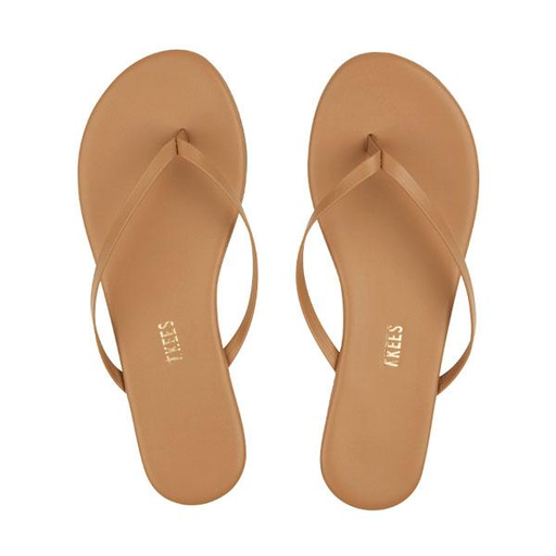 A pair of Tkees Lily Nudes Sandals in tan, featuring thin straps and a cushioned insole made from Brazilian leather, displayed side by side on a white background.
