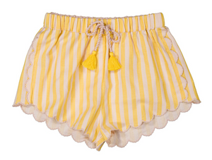 Louis Louise Girls’ Kalea Short in yellow and white stripes, designed with scalloped edges, an elastic waistband, and a drawstring finished with two yellow tassels, shown on a white background.