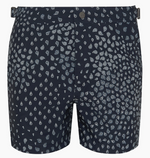 The Onia Calder Buckle 5" Swim Trunk for men in navy blue features quick-drying fabric, an adjustable waistband, and a white geometric drop pattern.