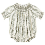 The Rylee & Cru Baby Girls' Ada Romper features short sleeves, a green floral print, a smocked neckline, and elastic leg openings for a cute and comfy style.