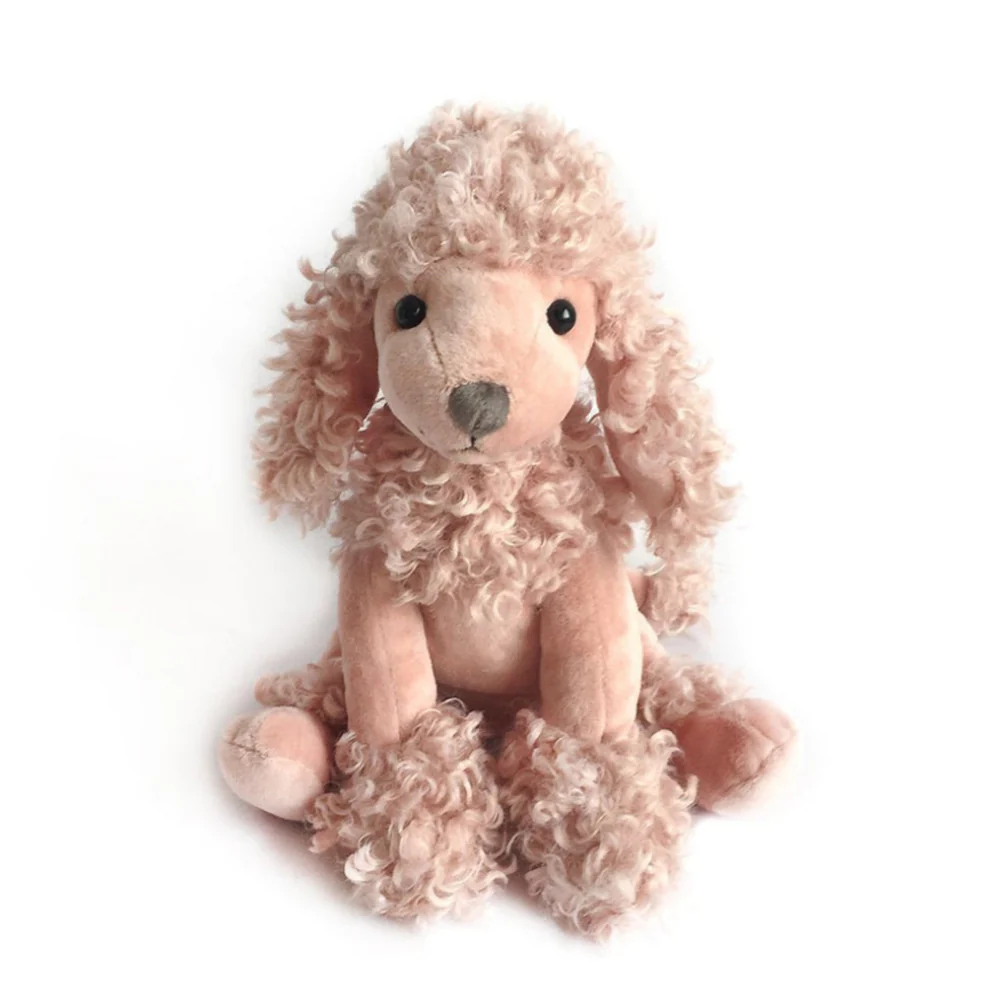 The Paris Mauve Poodle by Mon Ami sits upright with curly mauve pink fur on its head, ears, and paws, dark round eyes, and a stitched nose against a white background—one of our best-selling plush companions.