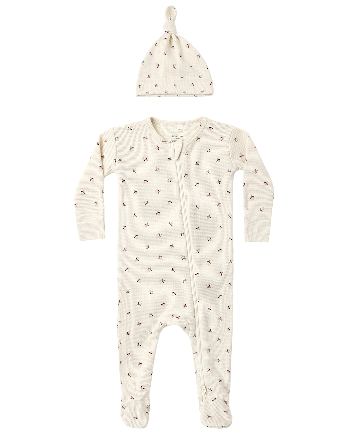 Quincy Mae Baby Waffle Sleep Set featuring an off-white waffle-knit zippered sleeper and matching knotted hat, both with a small floral print.