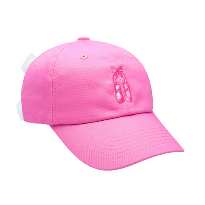 The Bits & Bows Ballet Slippers Bow Hat is a bright pink hat adorned with delicate ballet slipper embroidery on the front and finished with a white adjustable strap at the back.
