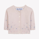 The Tartine et Chocolat Baby Girls’ and Girls’ Emeraude Embrodery Floral Cardigan is a light pink knit crafted from soft wool, adorned with delicate blue and pink floral embroidery, featuring a scalloped hem and two front buttons.