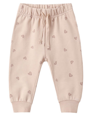 Quincy Mae Girls’ Relaxed Sweatpant in light beige features a drawstring waist, ribbed cuffs, and an all-over pattern of small outlined hearts—perfectly designed for all-day comfort.