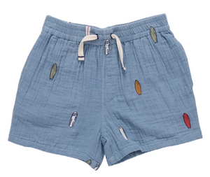 The Boys’ Calvin Short from Pink Chicken is a light blue cotton short with a drawstring waist, accented by colorful surfboard embroidery—ideal beachwear for little adventurers.
