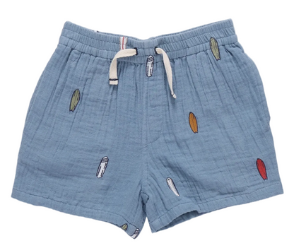 The Boys’ Calvin Short from Pink Chicken is a light blue cotton short with a drawstring waist, accented by colorful surfboard embroidery—ideal beachwear for little adventurers.