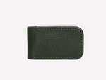 The Ettinger Capra Magnetic Cash Clip is a minimalist money clip in dark green luxury goat leather with visible stitching, shown against a plain light background.
