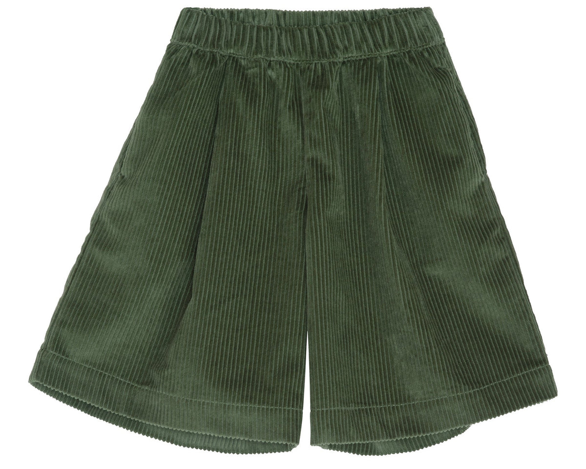 A Girls’ Corduroy Culotte Skirt by Serendipity, featuring an elastic waistband and wide legs, crafted from soft organic cotton in a green hue and displayed flat on a white background.
