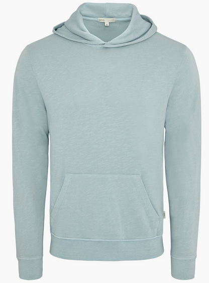 The Onia Terry Pullover Hoodie, made from heavyweight light blue cotton terry, features a front kangaroo pocket and is shown against a plain white background.