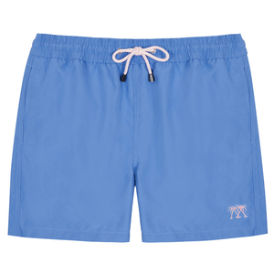 The Mens Plain Trunks by Pink House Mustique are blue swim trunks with an elastic waistband, white drawstring, and a small palm tree embroidery on the lower left leg. They feature a Velcro back pocket and are shown against a white background.