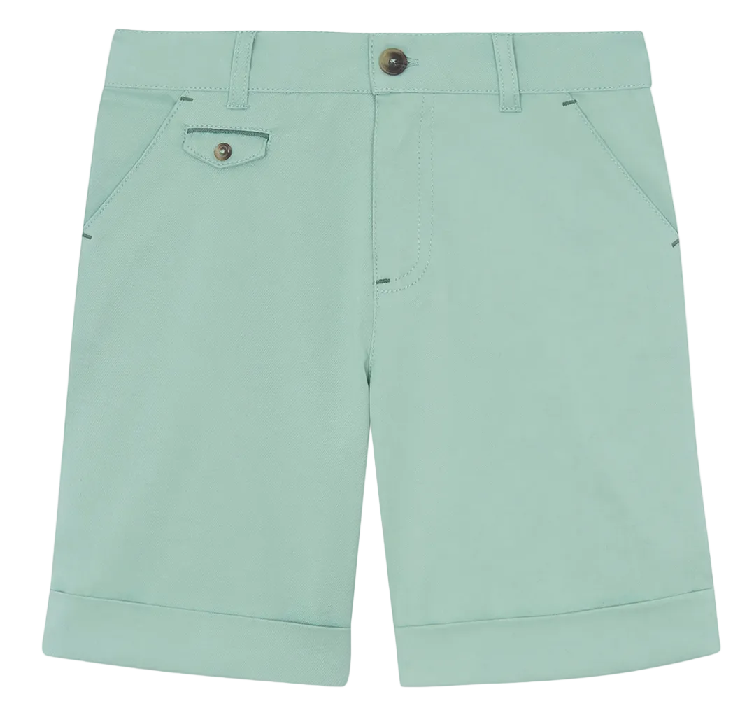 Introducing the Tartine et Chocolat Boys’ Cotton Short: knee-length shorts in light green, featuring cuffed hems, front pockets, belt loops, and a coin pocket with a button flap. Designed with a front button and zip closure and crafted from breathable cotton fabric, these shorts are perfect for active play.